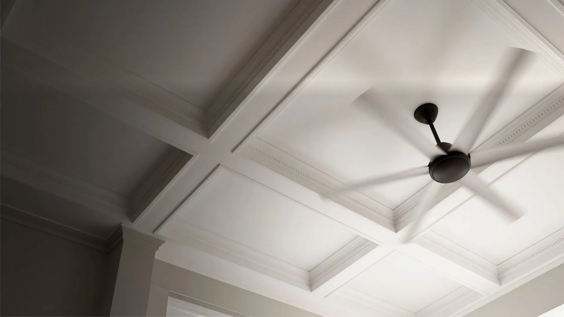 A ceiling fan seen from directly below
